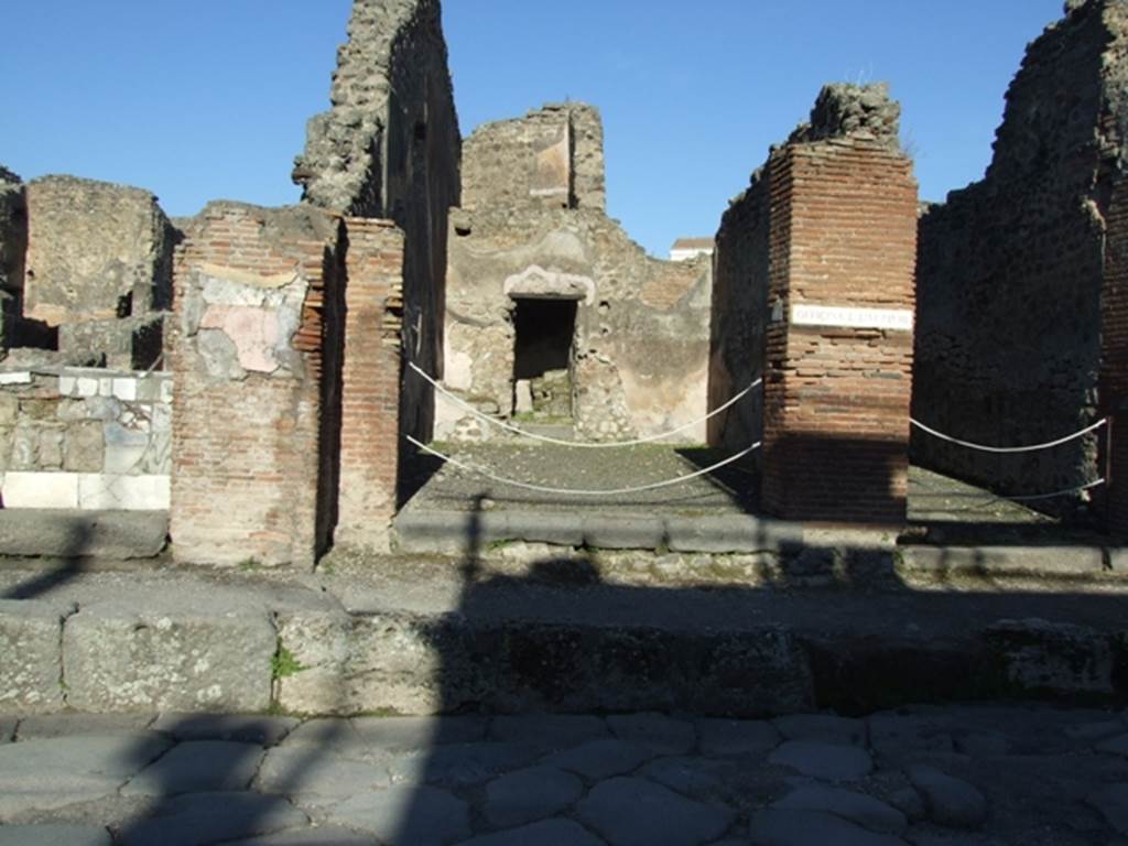 IX.1.4 Pompeii. March 2009. Entrance on Via Stabiana. Looking east.
Apart from the graffiti found in February 1852, on the pilaster between IX.1.3 and IX.1.4 (on the left), see IX.1.3 In September 1852, the following were also found painted in red on the same pilaster,

Ceium  II vir(um)   [CIL IV 944]

Helvium  aed(ilem)  [CIL IV 945]

See Pagano, M. and Prisciandaro, R., 2006. Studio sulle provenienze degli oggetti rinvenuti negli scavi borbonici del regno di Napoli.  Naples : Nicola Longobardi.  (p.167)
