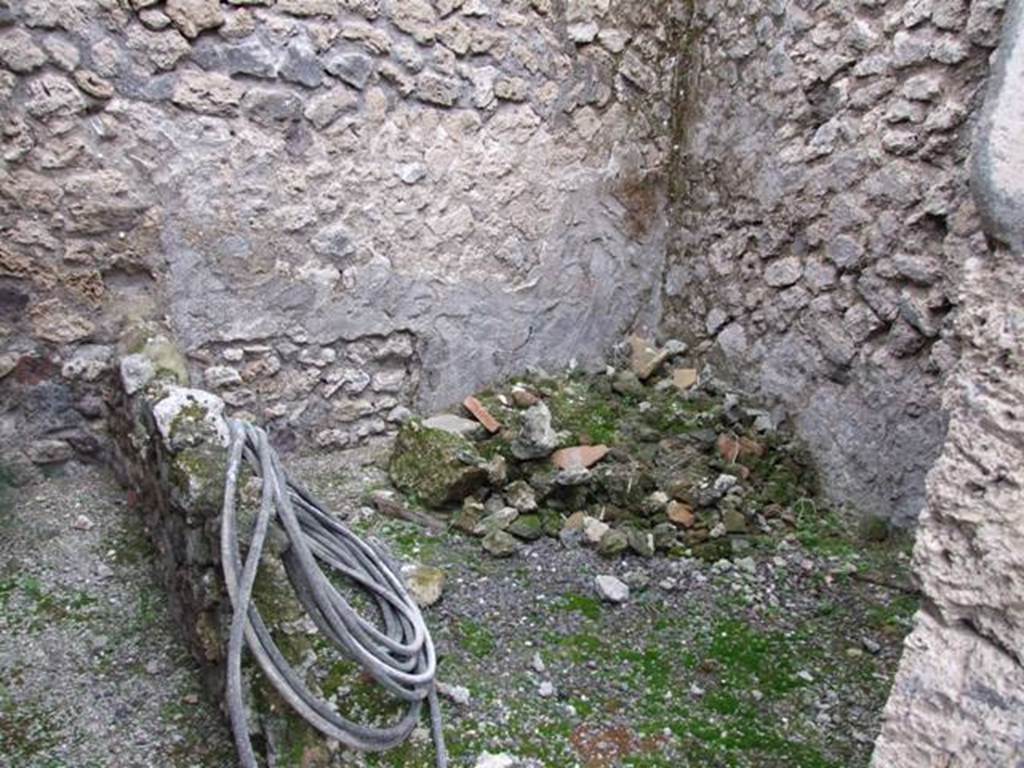 IX.1.7 Pompeii. December 2007. Looking towards east wall, on left, through doorway. This was a cubiculum with stairs to the kitchen, according to Fiorelli, in the south-east corner of atrium. 
According to Eschebach, this was the kitchen and latrine, with stairs to the upper floor above an “apotheca”. 
See Eschebach, L., 1993. Gebäudeverzeichnis und Stadtplan der antiken Stadt Pompeji. Köln: Böhlau, (p.399).

