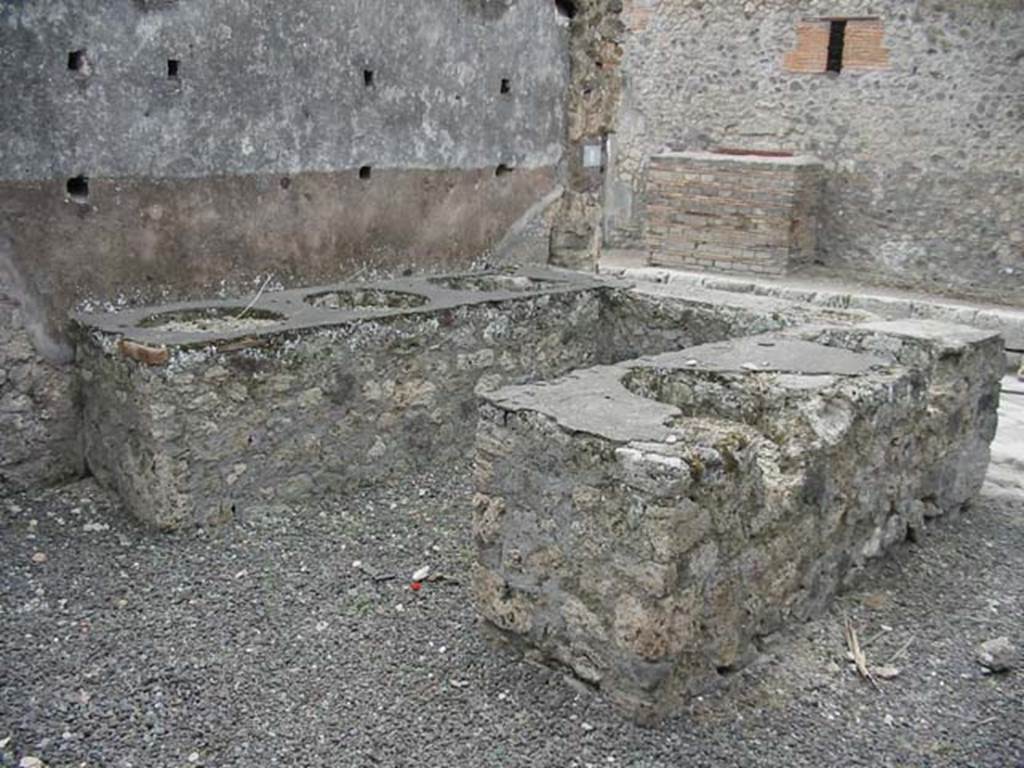 IX.1.8 Pompeii. May 2003. Looking south-west across bar counter from rear. Photo courtesy of Nicolas Monteix.