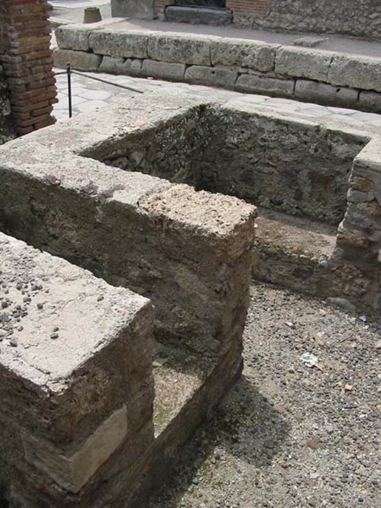 IX.1.13 Pompeii. May 2003. Looking south-west towards Via Stabiana, across hearth and counter. Photo courtesy of Nicolas Monteix.