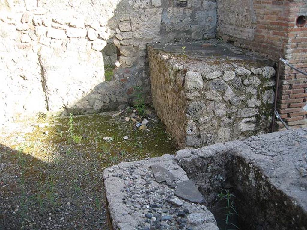 IX.1.13 Pompeii. May 2013. Hearth on south side of shop-room. Photo courtesy of Paula Lock.