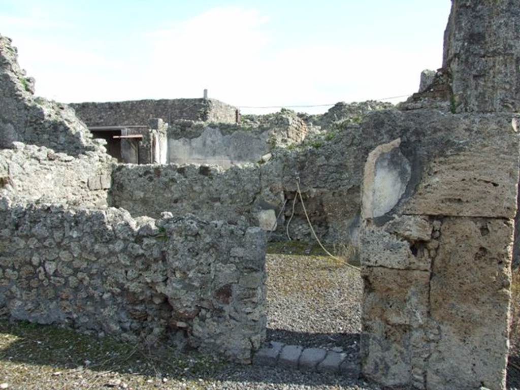 IX.2.17 Pompeii.  March 2009.  Room 7, Exedra. Small doorway in South wall, leading to Room 8, Triclinium.