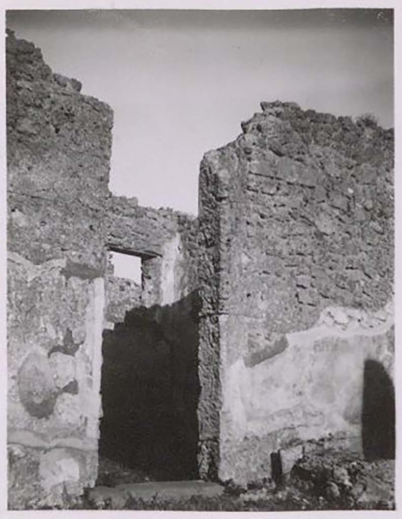 IX.2.17 Pompeii. Pre-1943. Doorway to room 3, triclinium. Photo by Tatiana Warscher.
According to Warscher – this room had a window overlooking Vicolo di Tesmo.
The paintings from the walls had vanished without leaving any trace. 
See Warscher, T. Codex Topographicus Pompeianus, IX.2. (1943), Swedish Institute, Rome. (no.88.), p. 170.
The remains of the arca/money chest base can be seen bottom right.

