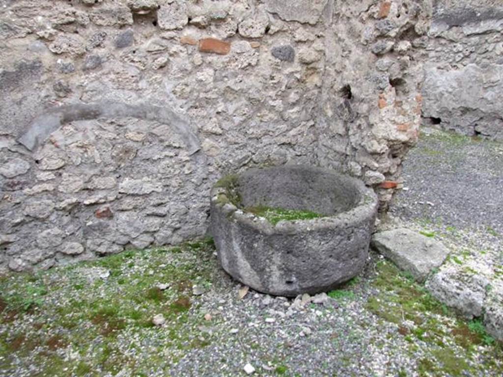 IX.3.20.  Bakery.  December 2007.  Room 5.  Remains of Tufa basin in doorway to room 6.