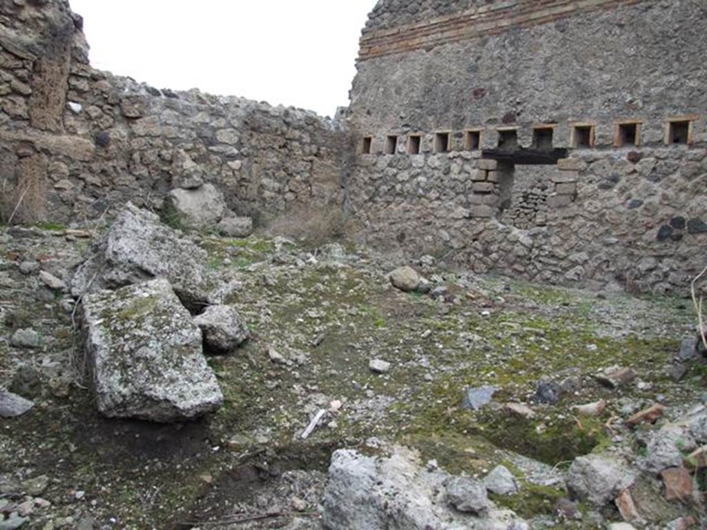 IX.3.20 Pompeii. December 2007. Room 2, stables. In the east wall, the holes for the support beams of an upper floor/mezzanine can be seen.
