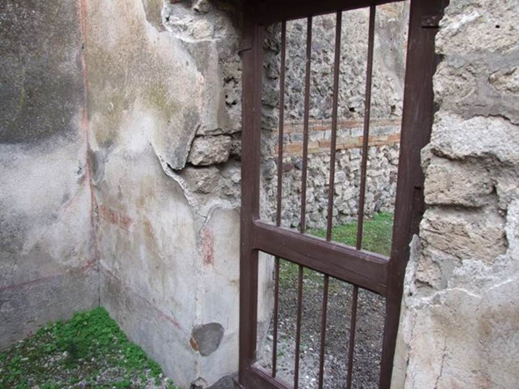 IX.5.2 Pompeii. December 2007. Room 5, north wall in north-west corner, with doorway to IX.5.1.
