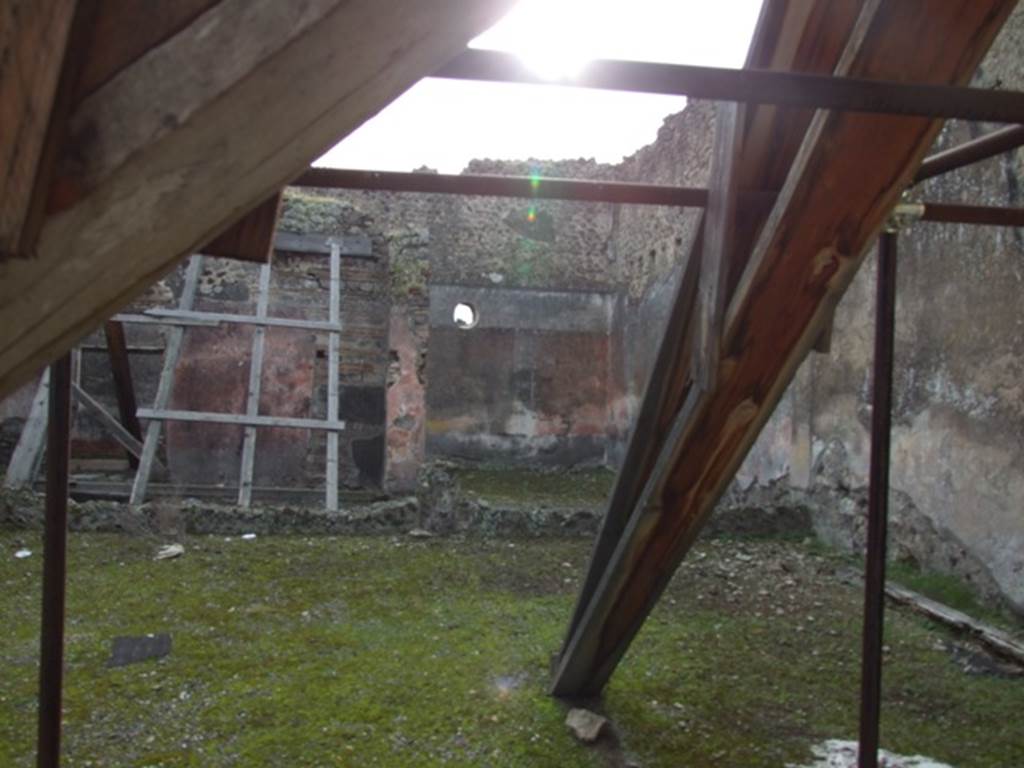 IX.5.9 Pompeii. December 2007. Looking south across peristyle i to doorway of room o with wooden scaffolding and room p in corner.  
  