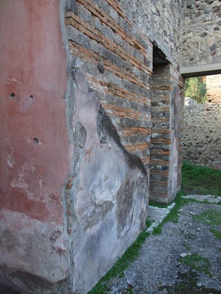 IX.5.11 Pompeii. December 2007. Looking north-west.
Room 8, north-east corner of ala and atrium wall, with doorways to rooms 9 and 10.
Mau thought that, almost certainly, on this pilaster facing onto the atrium would have been a personification of either autumn or winter, as was seen on the pilasters between rooms 3 and 4, and 7 and 8.  
See Bullettino dellInstituto di Corrispondenza Archeologica (DAIR), 1879 (p.197).
