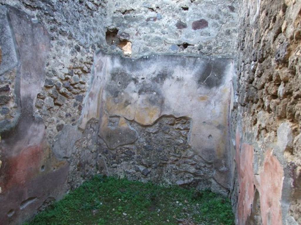 IX.5.11 Pompeii. December 2007. Room 18, cubiculum, looking west. The decoration of the walls in this cubiculum was in the IVth Style, with red zoccolo. The middle zone of the walls had traces of burning.
