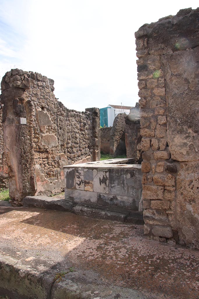 IX.7.24 Pompeii. October 2024. 
Looking south-east towards entrance from roadway. Photo courtesy of Klaus Heese.
