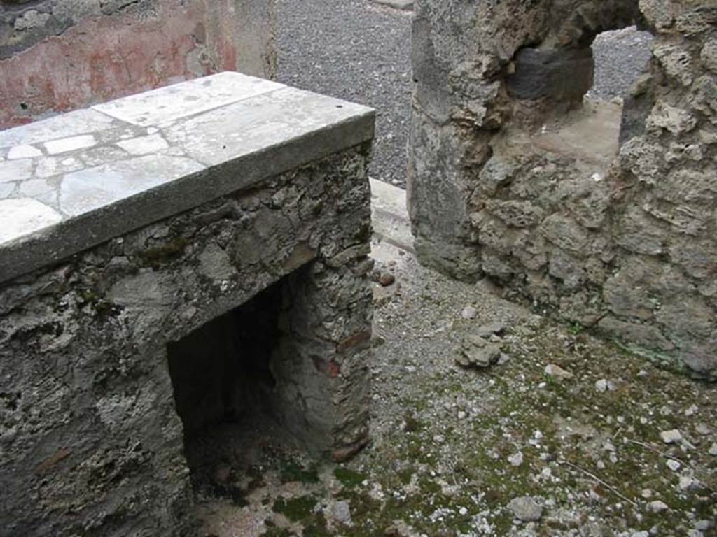 IX.7.24 Pompeii. May 2003. Looking south-east towards rear of counter. Photo courtesy of Nicolas Monteix.