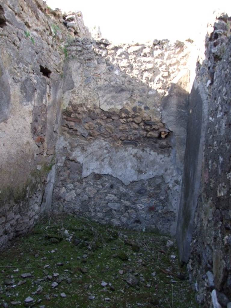 IX.9.13 Pompeii.  March 2009.  Room 9.  Kitchen.  North wall with remains of hearth or bench.