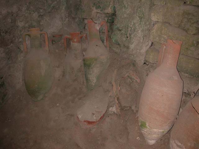IX.11.2 Pompeii. May 2003. Amphorae against east wall. Photo courtesy of Nicolas Monteix.