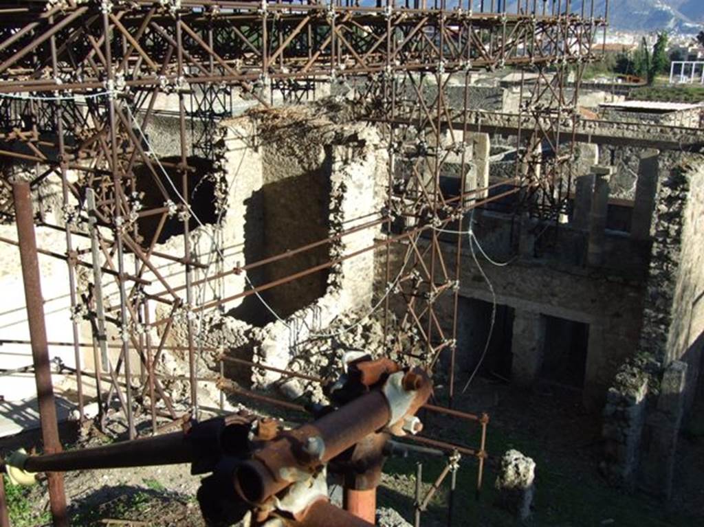 IX.12.5, IX.12.4  and IX.12.3 Pompeii.  March 2009.  Showing rear view of upper terrace , and partly excavated rooms below.