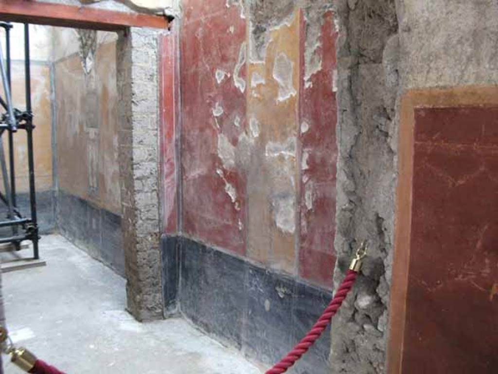 IX.12.9 Pompeii. May 2010. Room 11, east wall, in centre, with east wall of room 12, on left.