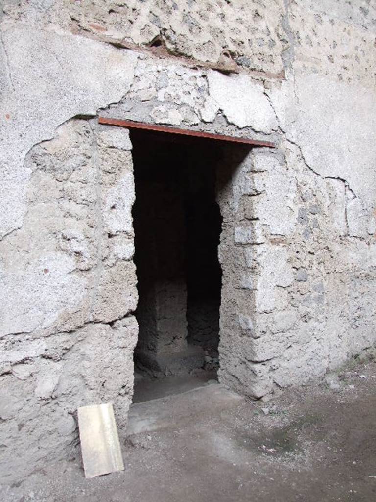 IX.12.9  Pompeii. December 2006. Street entrance to kitchen and latrine.
This would have been the secondary entrance to kitchen and latrine. 
The main entrance to the house is probably on the western side of the insula and has not yet been identified.


