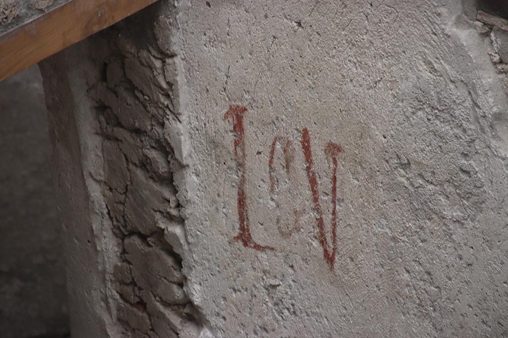 IX.12.B Pompeii. October 2024. Room 15, detail of painted inscription on west wall. Photo courtesy of Klaus Heese.