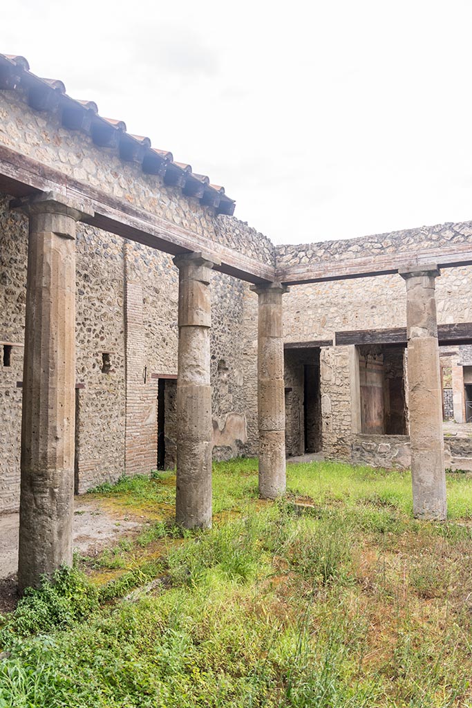 IX.14.4 Pompeii. July 2024. 
Looking towards west portico and north-west corner of peristyle 1. Photo courtesy of Johannes Eber.
