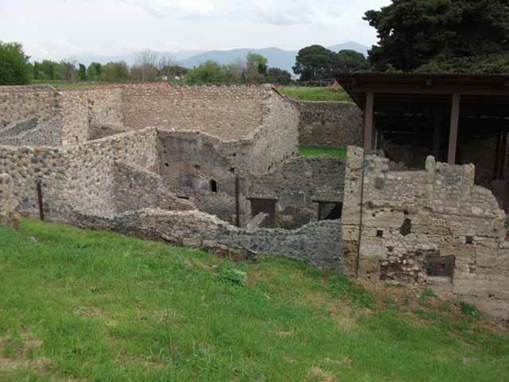 IX.14.b Pompeii, May 2010.  Looking east at outside wall, with blocked entrance doorway.