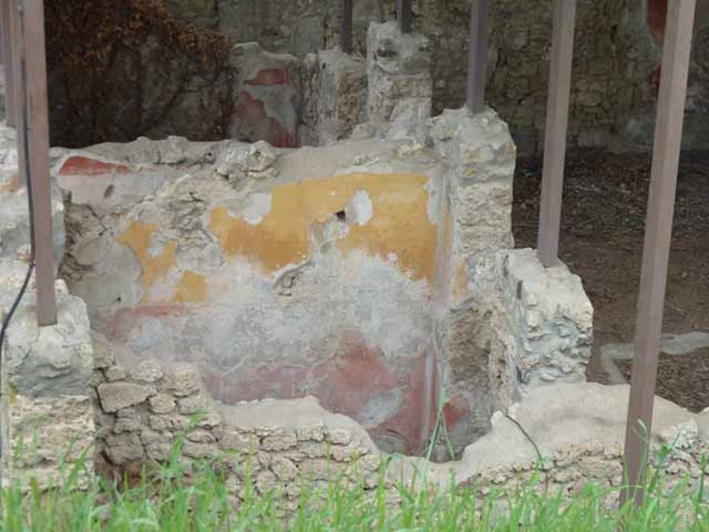 IX.14.c Pompeii. May 2010. Room 5, room on south side of entrance corridor. North wall. According to NdS, both rooms 4 and 5 had a similar wall decoration, low black plinth, red decorations and frieze of yellow. A square window was found high in the western wall. To the right of the south wall was a recess for the edge of a bed along the west wall. The flooring was of signinum with tesserae placed in lines forming a lozenge design. See Notizie degli Scavi di Antichit, 1911, p. 375.