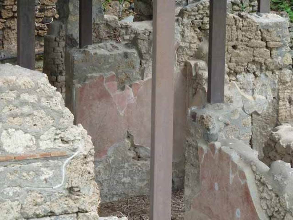 IX.14.c Pompeii. May 2010. Looking east through the entrance corridor to atrium. Doorway to room 7 is on right behind the south wall of fauces 1.