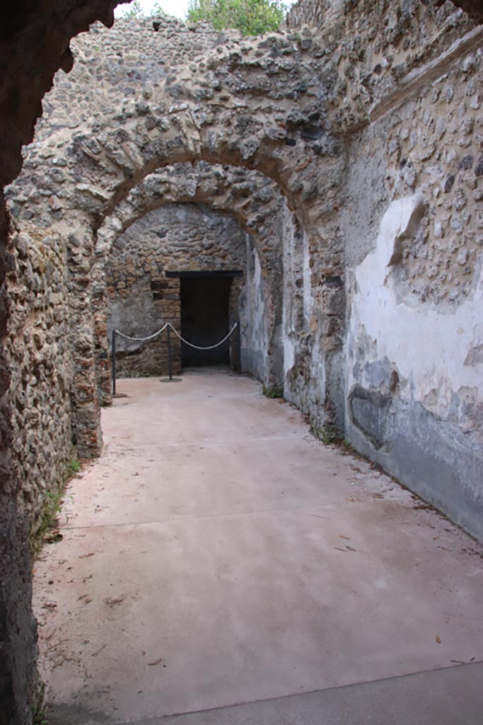 Villa of Diomedes, Pompeii. October 2023. 
Looking east along the south side of the portico, into corridor/rooms. Photo courtesy of Klaus Heese.
(Villa Diomedes Project – area 46, from area 45).
(Fontaine, corridor/rooms 5a, from 5b).
