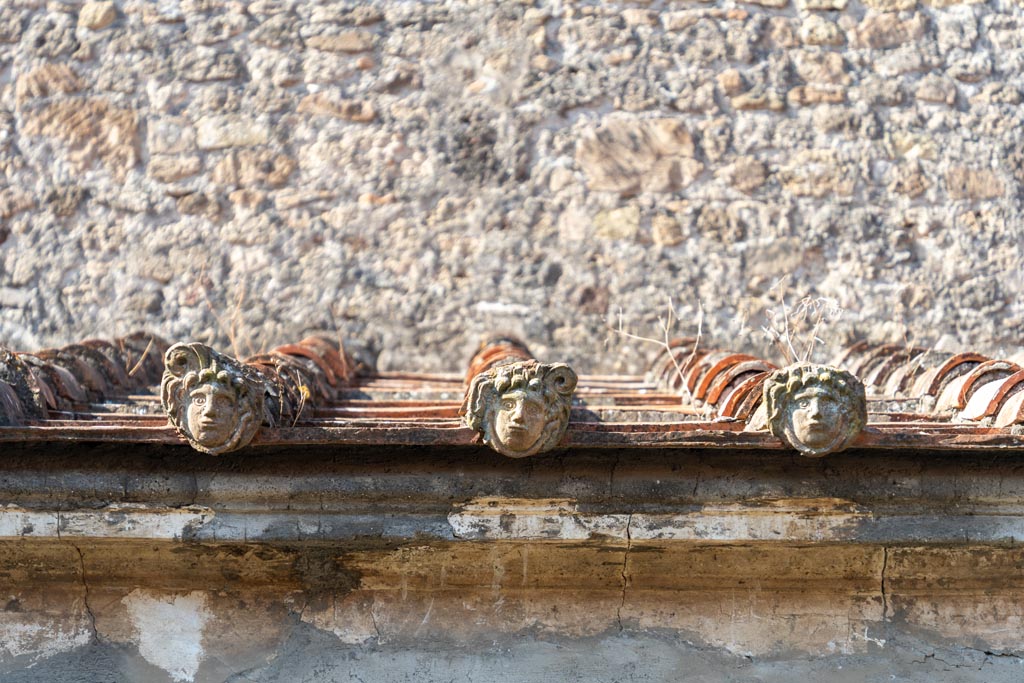 Villa of Mysteries, Pompeii. October 2023. Rain-water spouts, in situ on roof behind crypt. Photo courtesy of Johannes Eber.