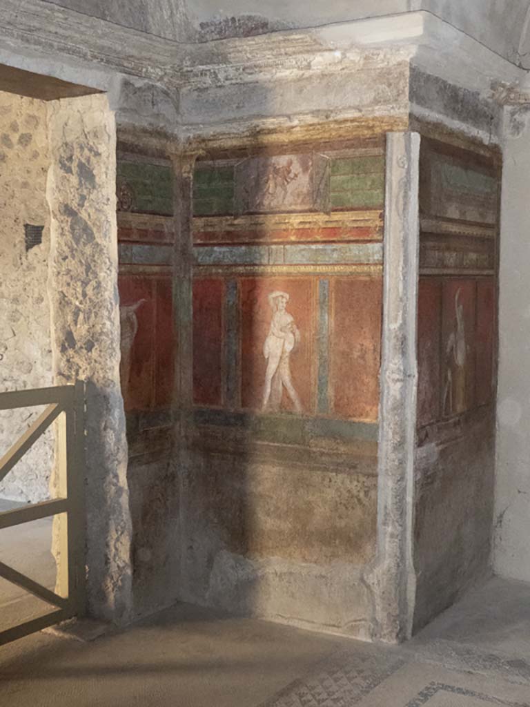 Villa of Mysteries, Pompeii. May 2006. Room 4, north side of doorway to room 3 under arched ceiling, wall painting of Silenus and a satyr. 
