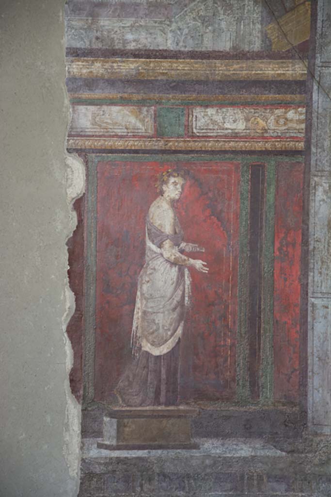 Villa of Mysteries, Pompeii. May 2010. Room 4, detail of wall painting of a priestess, on east wall.