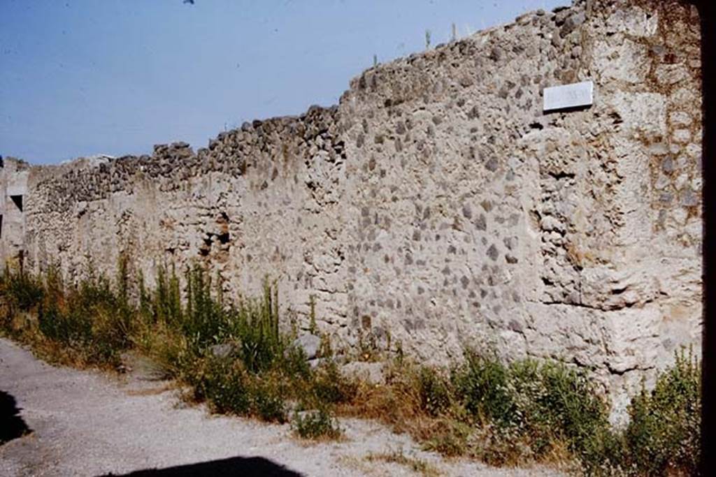 Via di Castricio, north side, Pompeii. 1964. Looking north-west to doorway at I.11.10, on left.  Photo by Stanley A. Jashemski.   
Source: The Wilhelmina and Stanley A. Jashemski archive in the University of Maryland Library, Special Collections (See collection page) and made available under the Creative Commons Attribution-Non Commercial License v.4. See Licence and use details.
J64f1523
