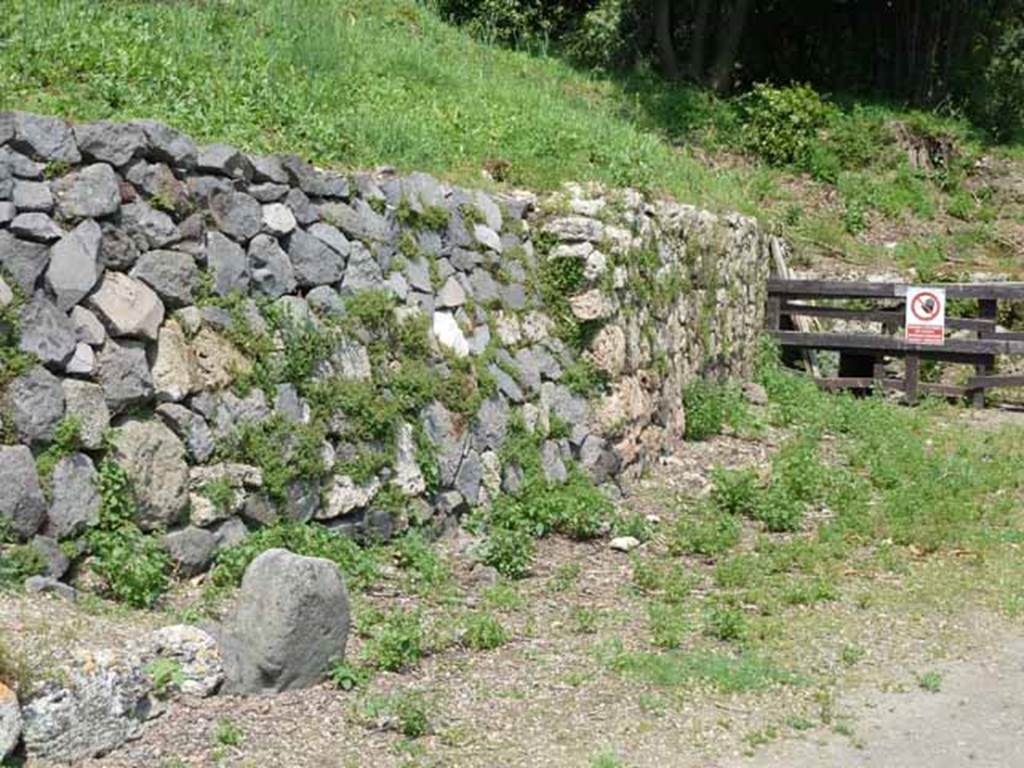 Via di Nola, north side, May 2010.  East side of IV.5, boundary marker and site of road.