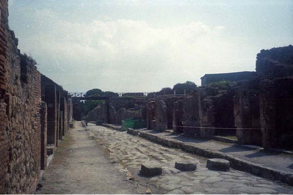 Via di Nola between V.4 and IX.9. July 2011. Looking east from near V.4.1 and IX.9.3. 
Photo courtesy of Rick Bauer.
