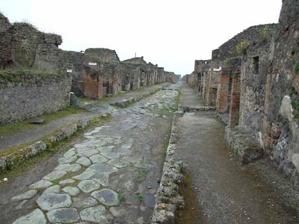 Via di Nola, May 2010. Looking west between IX.10 and V.5 towards junction.