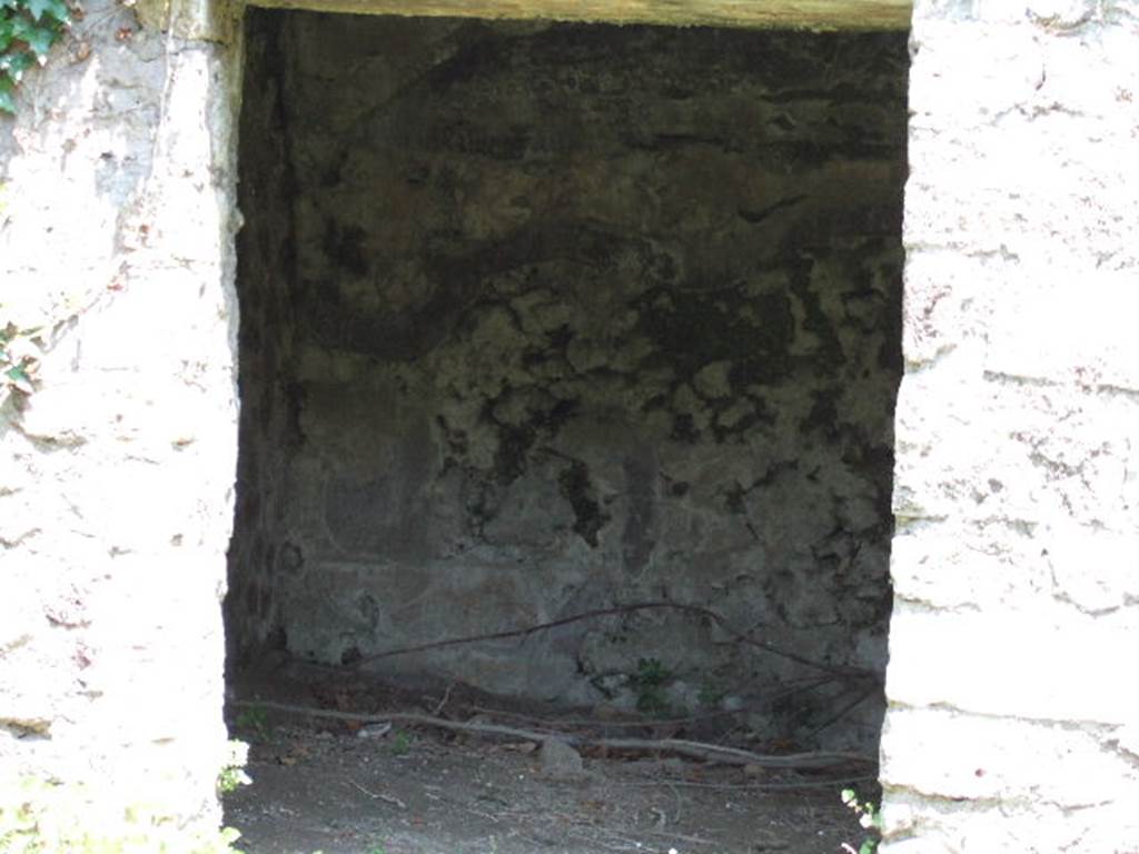 HGE20 Pompeii. June 2016. A circular pit, which is accessed by a few steps, must be related to bronze work. 
The excavation of the HGE20 store identified a polymetallic production workshop, where bronze and iron were worked, installed in the back room of the building and in the room opening onto the portico. A circular pit, which is accessed by a few steps, must be related to bronze work. This is a casting pit, also used for firing the moulds needed to make bronze objects. This is the first permanent installation, unrelated to a construction site, discovered so far. In the main room, remains linked to the work of iron - slag, scale - make it possible to restore an activity linked to the work of this metal, probably thanks to a forge on a table. The two activities appear to have coexisted in the same store, although the workshop was no longer in operation at the time of the eruption.

Une fosse circulaire,  laquelle on accde par quelques marches doit tre mise en relation avec le travail du bronze.
La fouille de la boutique N20 a permis didentifier un atelier de production polymtallique, o lon travaillait le bronze et le fer, install dans larrire-boutique de ldifice et dans la pice ouvrant sur le portique. Une fosse circulaire,  laquelle on accde par quelques marches doit tre mise en relation avec le travail du bronze. Il sagit dune fosse de coule, servant galement pour la cuisson des moules ncessaires  la fabrication dobjets en bronze. Il sagit de premire installation prenne, non lie  un chantier de construction, dcouverte jusqualors. Dans la pice principale, des restes lis au travail du fer - scories, battitures - permettent de restituer une activit lie au travail de ce mtal, vraisemblablement grce  une forge sur table. Les deux activits semblent avoir coexist dans la mme boutique, mme si latelier ntait plus en activit au moment de lruption.

See Pompei- le secteur de la Porte dHerculanum  Pompi Centre Jean Brard
