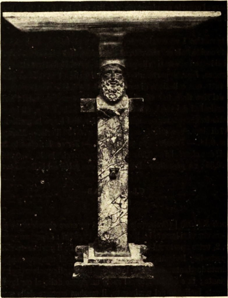 Pompeii, Villa rustica nel Fondo di Antonio Prisco. Marble table.
See Notizie degli Scavi di Antichità, 1921, p. 418, fig. 2.
But a find of more importance was a beautiful marble table. 
The marble top of the table 0.75 x0.47m, in “fior di persico” (a rich marble, mottled with red and white) was supported by a monopodium 0.92m high, rising from a simply formed base. 
The monopodium was decorated by a herm, at the top of which was a bearded Hermes with a head in “rosso antico” (maroon red marble from Greece), the feet of “giallo antico” (yellow marble from Numidia) and the trunk of “marmo africano”(dark, generally black, marble from Turkey).
