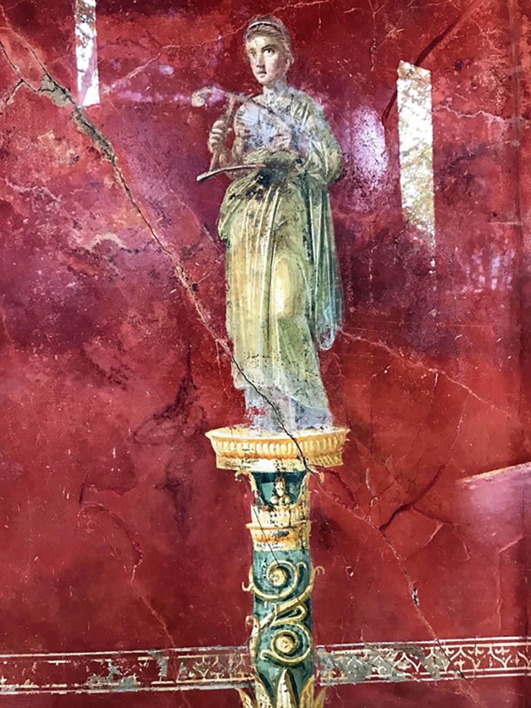 Complesso dei triclini in località Moregine a Pompei. December 2019. 
Triclinium A, west wall. Terpsichore the Muse of dance and chorus with a cithara. Photo courtesy of Giuseppe Ciaramella.

