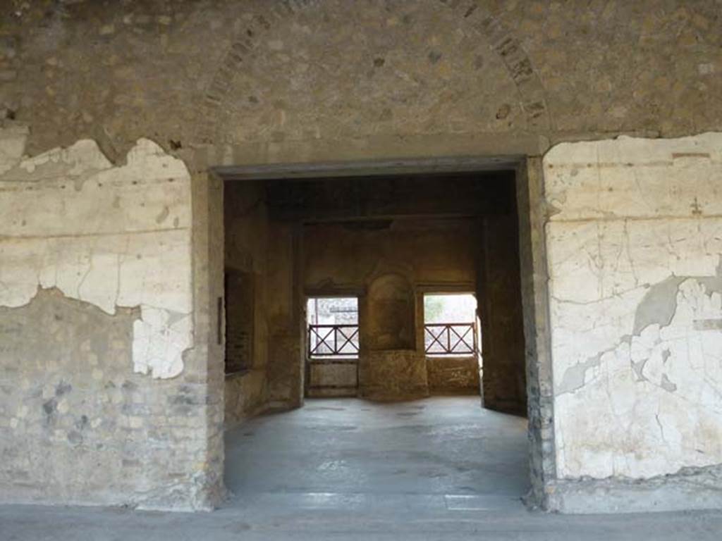 Oplontis, September 2011. Area 60, the west portico wall with doorway to room 65, and room 64, with niche in west wall at its rear. Photo courtesy of Michael Binns.
