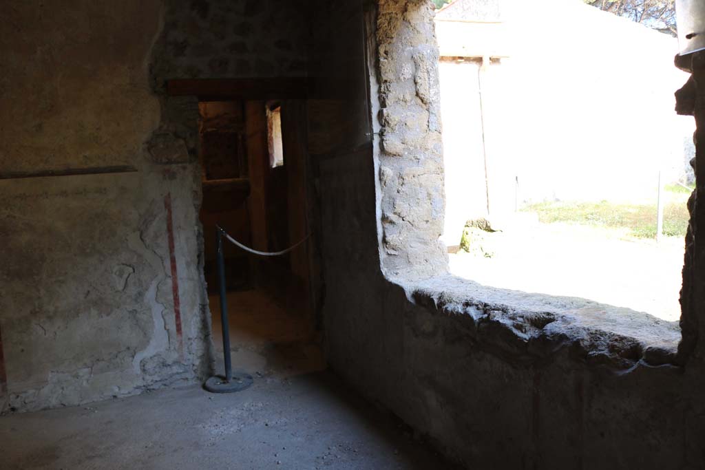 II.9.4 Pompeii. December 2018. 
Room 5, north-east corner with doorway to room 6, cubiculum with floral lararium. Photo courtesy of Aude Durand.
