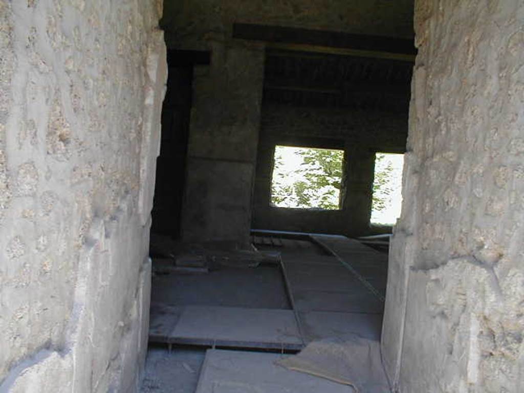 II.9.4 Pompeii. May 2005. Looking east from entrance corridor across atrium 2, towards rear room 5.. 