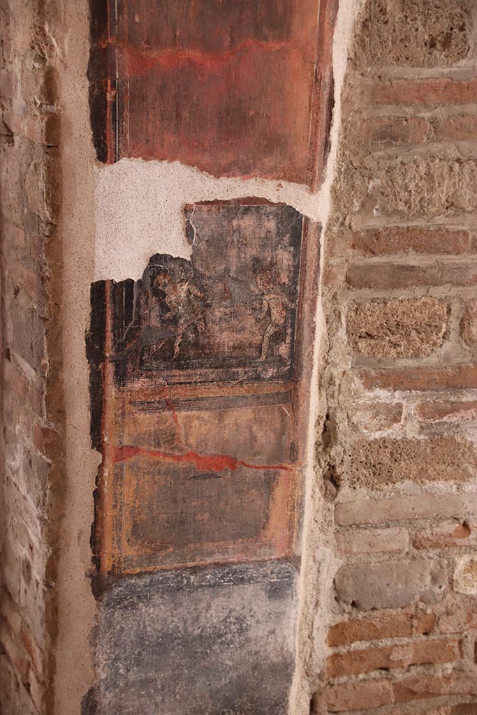 VI.15.1 Pompeii. October 2024. 
Painted decoration on pilaster on west side of entrance doorway, on south wall.
Photo courtesy of Klaus Heese.
