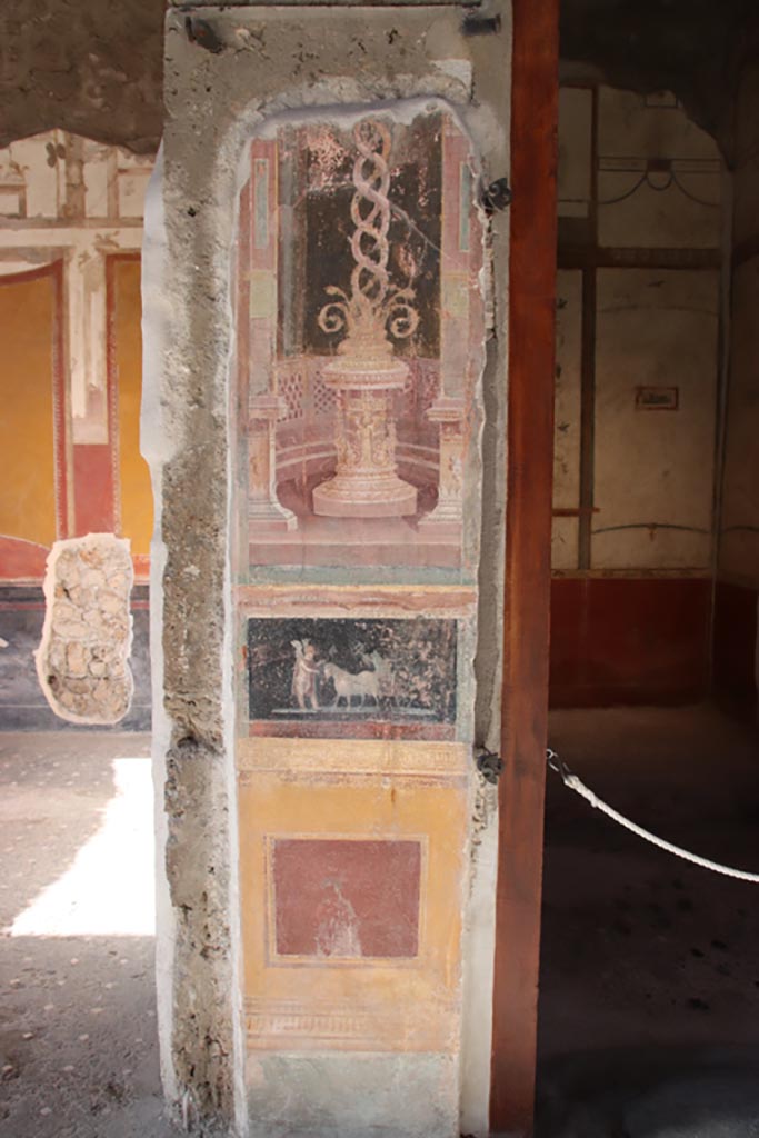 VI.15.1 Pompeii. October 2023.  
Painted panels on atrium wall between doorway to north ala, on left, and bedroom, on right.
Photo courtesy of Klaus Heese. 
