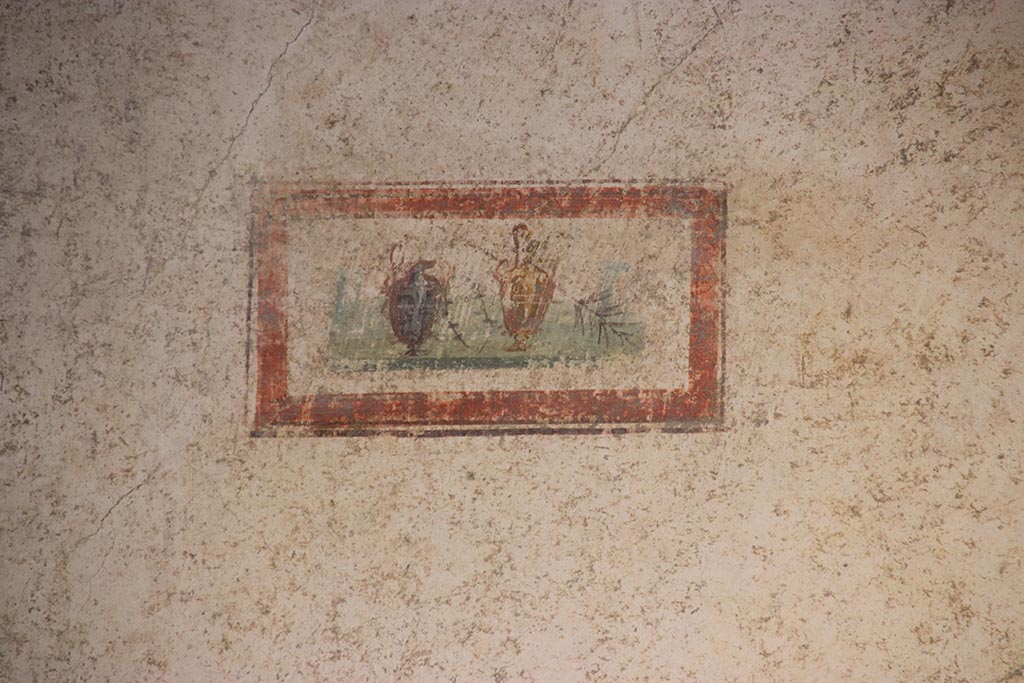 VI.15.1 Pompeii. October 2024. Cubiculum g, painted panel at west end of north wall. Photo courtesy of Klaus Heese.

