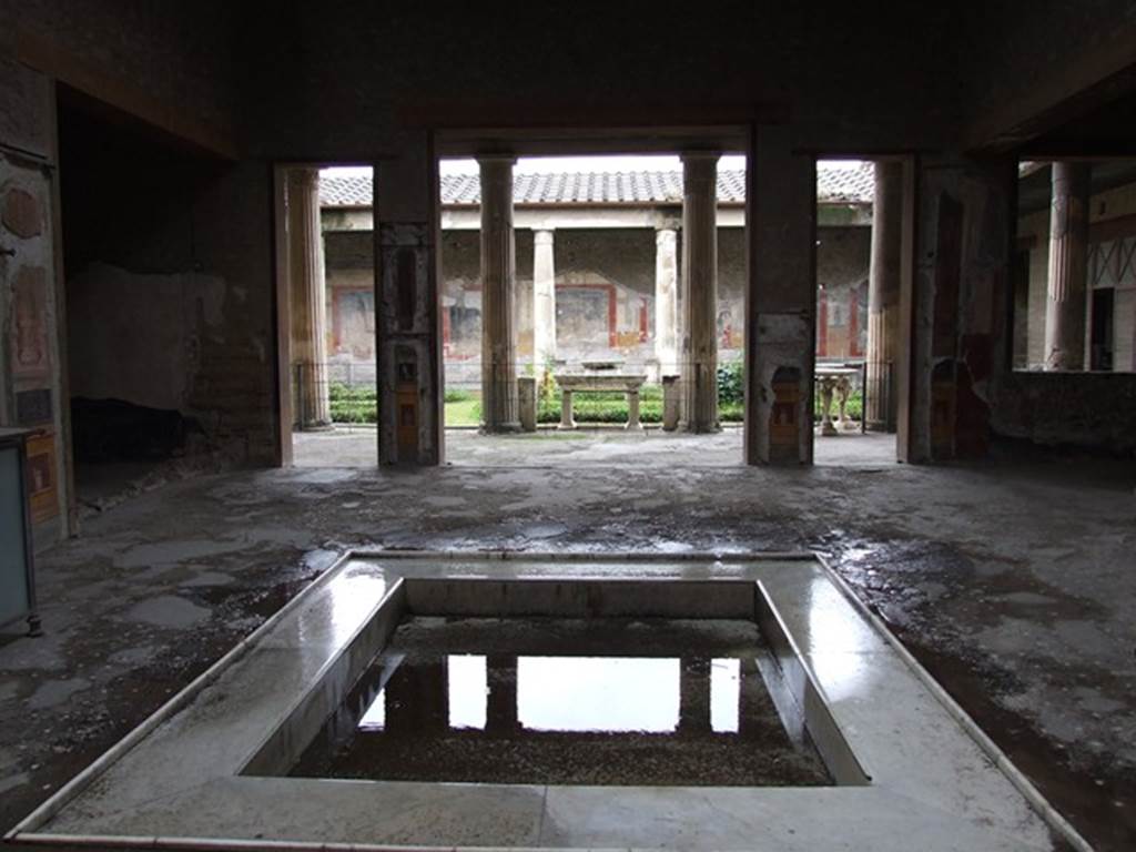 VI.15.1 Pompeii. December 2006. Looking west across impluvium in atrium