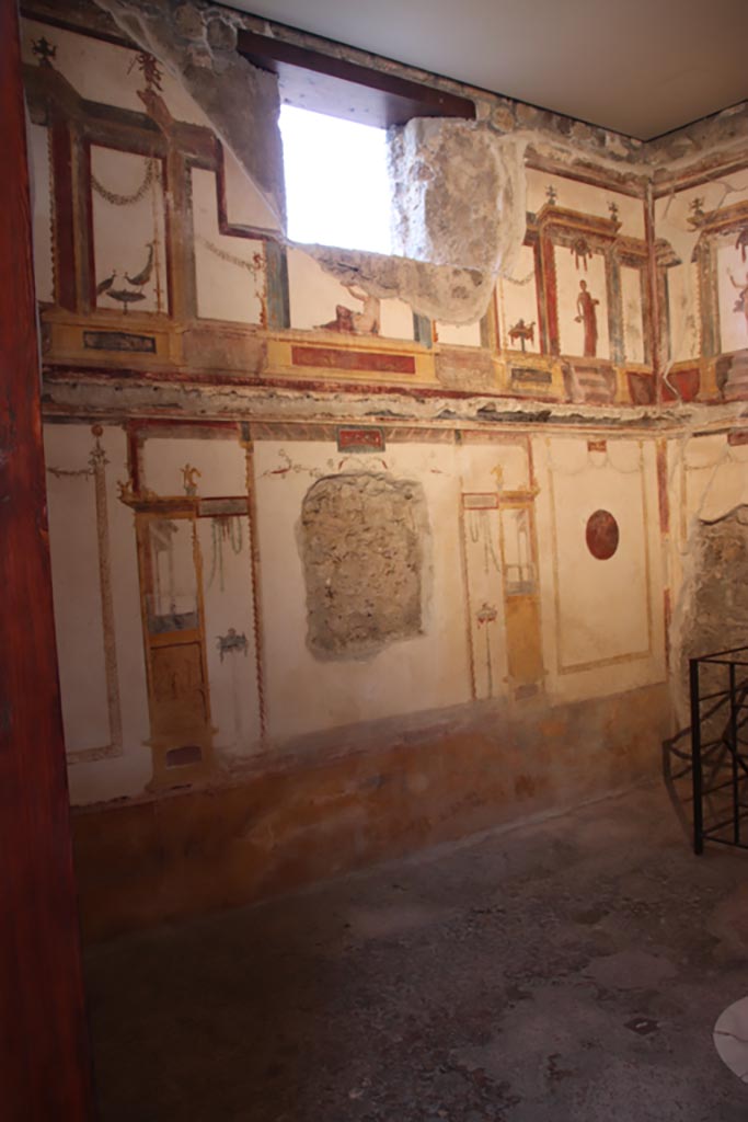 VI.15.1 Pompeii. October 2023. 
Looking towards south end of east wall from doorway. Photo courtesy of Klaus Heese.
