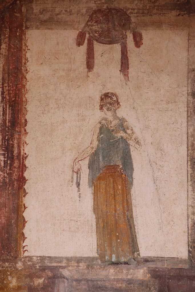 VI.15.1 Pompeii. October 2024. 
Detail of painted female figure from upper west wall at north end. Photo courtesy of Klaus Heese.
