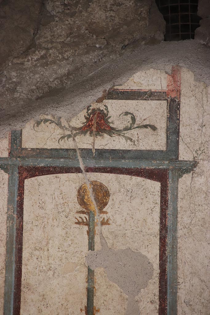 VI.15.1 Pompeii. October 2024. 
Room (f), painted panel above top of candelabrum in centre of south wall. Photo courtesy of Klaus Heese.
