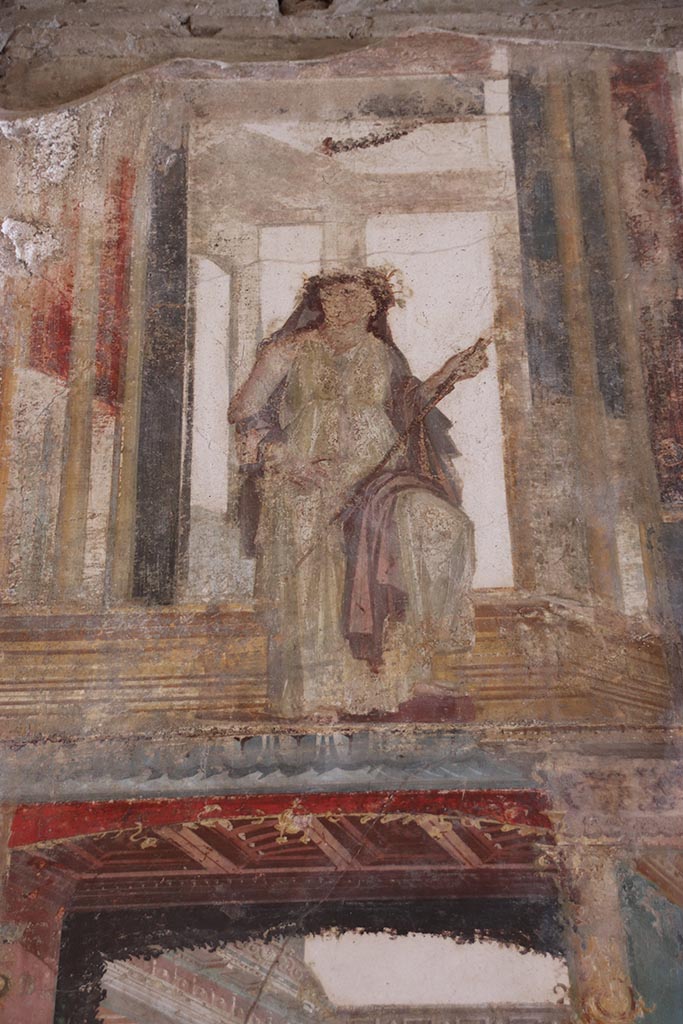 VI.15.1 Pompeii. October 2024. 
Upper south wall, detail of painted figure, continuation from south-east corner.
Photo courtesy of Klaus Heese.
