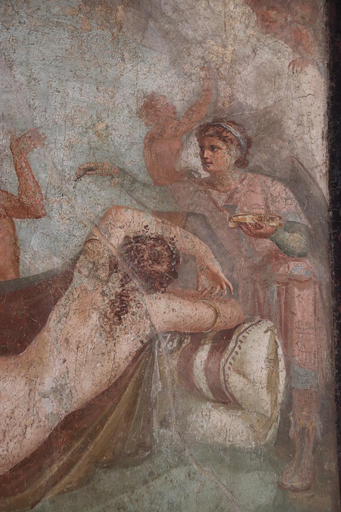 VI.15.1 Pompeii. October 2024.  
Hypnos (the god of sleep) with golden dish in his hand watching over Ariadne, detail of central painting from south wall.
Photo courtesy of Klaus Heese.
