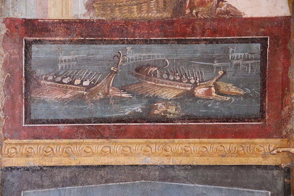 VI.15.1 Pompeii. October 2024. North wall of exedra, painted panel of naval scene. Photo courtesy of Klaus Heese.