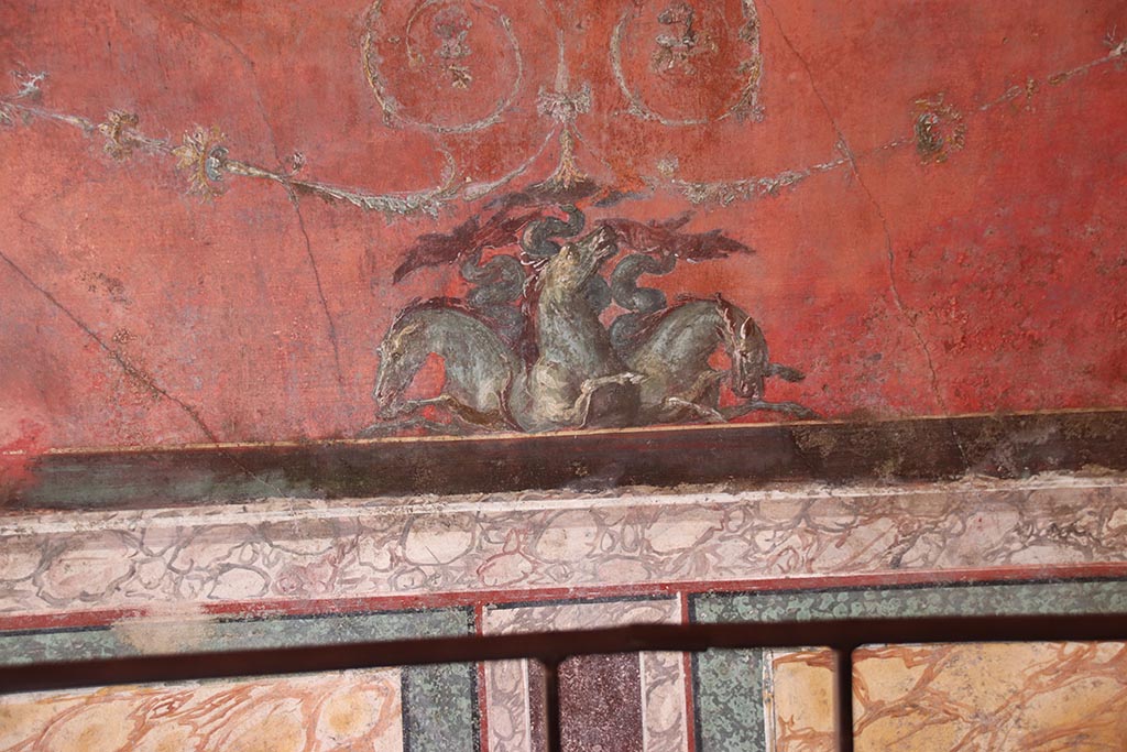 VI.15.1 Pompeii. October 2024. North wall of exedra – detail from below central painting. Photo courtesy of Klaus Heese.